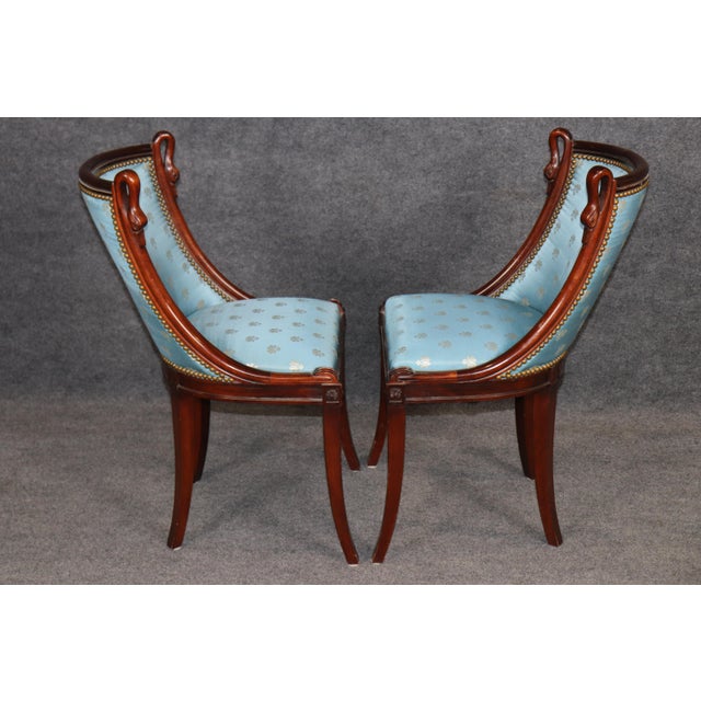 An elegant and highly refined set of four French Empire style side chairs, executed with remarkable sophistication and...