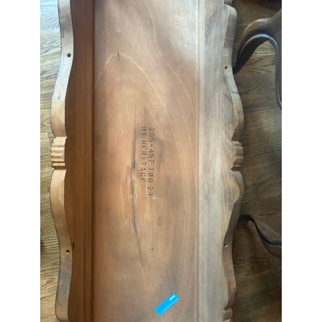 Classic craftsmanship and timeless design define this beautiful Heritage Furniture console table with its matching...