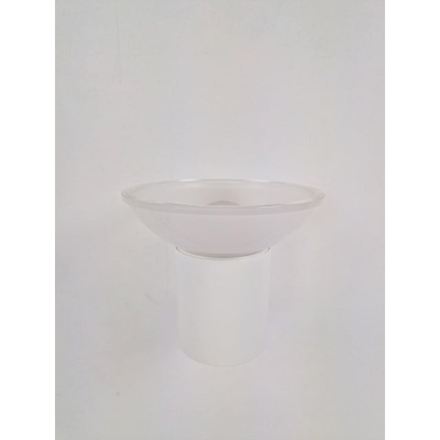 This is a minimalist glashütte limburg wall lamp from the 70s, characterized by a sleek white metal fixture combined with...