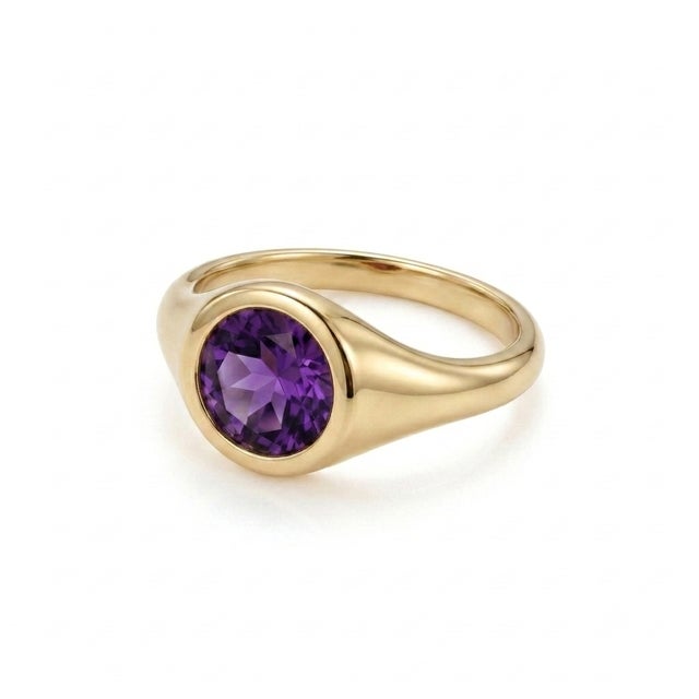 Embrace royal elegance with this striking Natural Amethyst signet ring. Highlighted by a rich, multi-faceted purple...