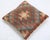 A one-of-a-kind handwoven Afghan wool kilim accent pillow featuring diamond lattice with a central hourglass on rust. Cut...