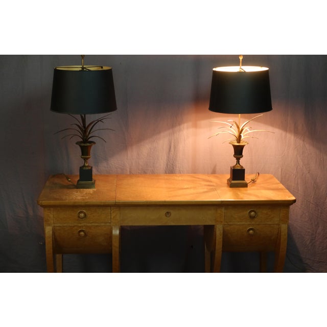 Pair of lamps from Maison Charles dating from the 1960s. This is the "Vase aux Roseaux" model, made of bronze and brass,...