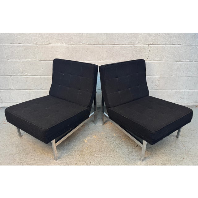 A refined pair of Mid-Century Modern “Model 51” armless slipper lounge chairs designed by Florence Knoll for Knoll...