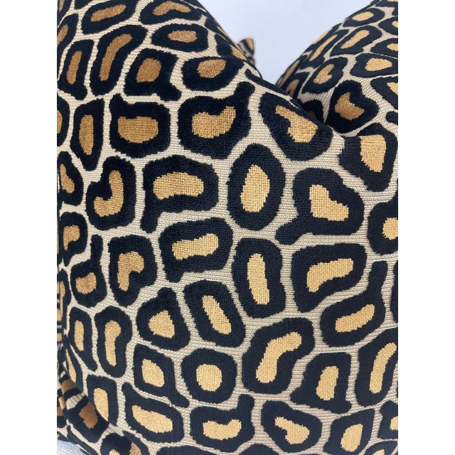 Custom pair of 22" pillows covered in a leopard print cut velvet in black and gold. These pillows have tapered corners to...