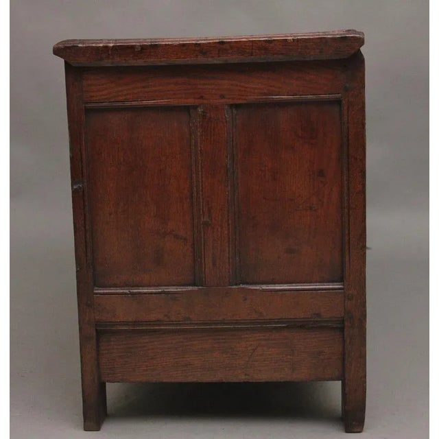 A nice quality early 18th Century oak coffer, the hinged moulded edge top lifting up to reveal a large compartment space...