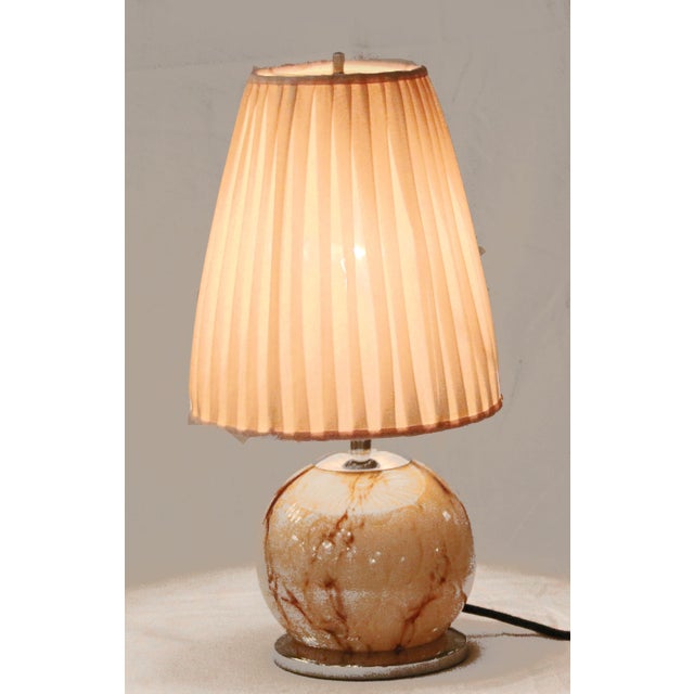 Art Deco floor lamp Art Deco table lamp, circa 1925. Marbled glass globe on a nickel-plated base. Renewed pink fabric...