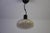White italian ceiling lamp, 1970s. This distinctive vintage pendant light features a rounded white metal shade with a...