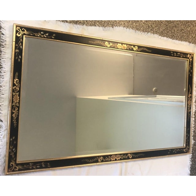 Vintage La Barge Chinoiserie-style mantel mirror with a black and gold lacquered frame. The black frame has gold-painted...