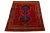 Vintage Hand-knotted Persian Shiraz Wool rug. This rug has a red field and navy blue accents in an over-tribal motif. this...