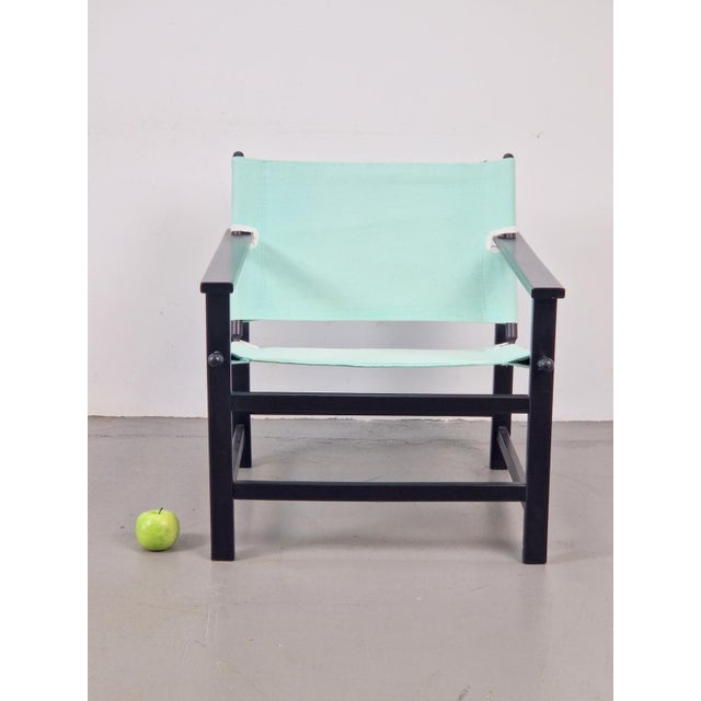 Vintage safari chair Hyllinge Møbler Denmark 1970 Beautiful vintage safari chair. This black beech chair with fabric...