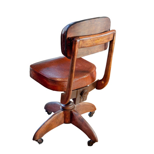 Vintage Gunlocke swivel office chair, made in New York, circa 1930s. This vintage chair is constructed of a heavy, solid...