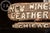 Pair of handcrafted storefront signs made for New Wineskins Leather Gallery, formerly located at 63 W. Division St. in...