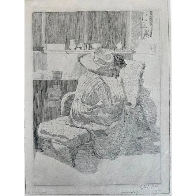 A wonderful interior scene. A woman in a large hat seated on a chaise turned away from us. What is she doing. Is it the...