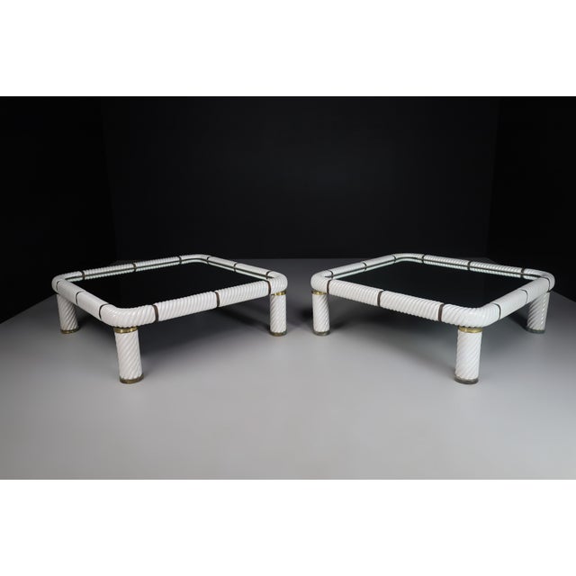 Stunning pair of two large Tommaso barbi white ceramic and brass coffee tables made and designed in Italy 1970s .These...