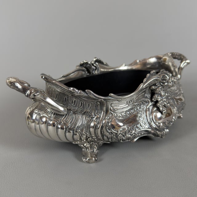 A masterpiece of exceptional stage presence and rare craftsmanship. This impressive centerpiece planter (or jardinière) in...