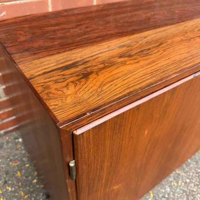 Danish modern rosewood credenza attributed to Carlo Jensen for Hundevad &amp; Co., circa 1960s. The rosewood has beautiful...