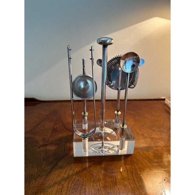 Elegant 1960s Italian Gio Ponti 5 piece cocktail bar tool set in silver plate and brass in lucite holder. Marked 'PM'...