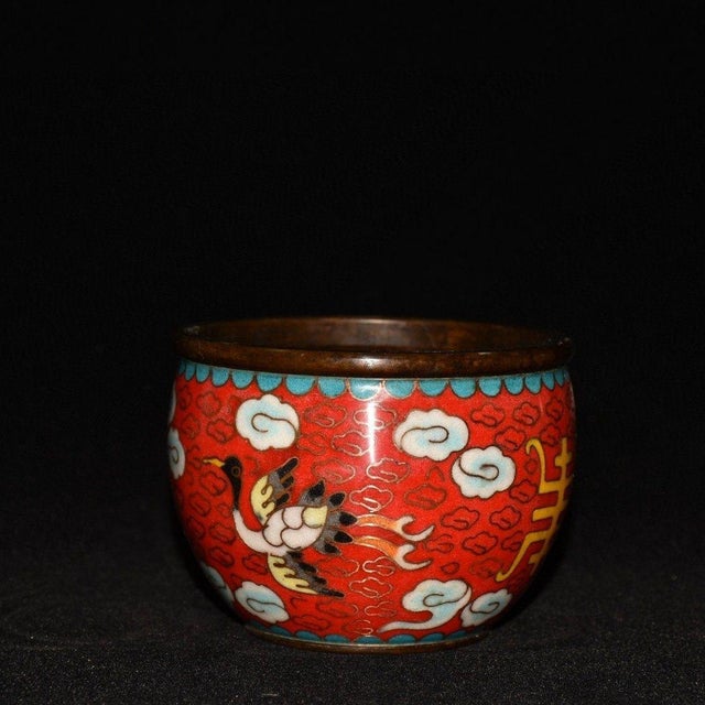This piece features a brilliant red background, beautifully decorated with intricate wire inlay (cloisonné) work. The...