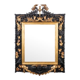 Gilded and ebonized oak Baroque mirror For Sale