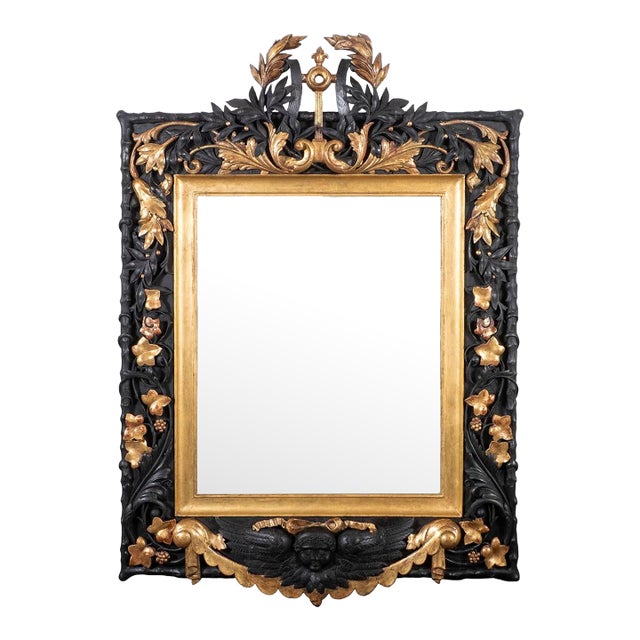 Gilded and ebonized oak Baroque mirror For Sale