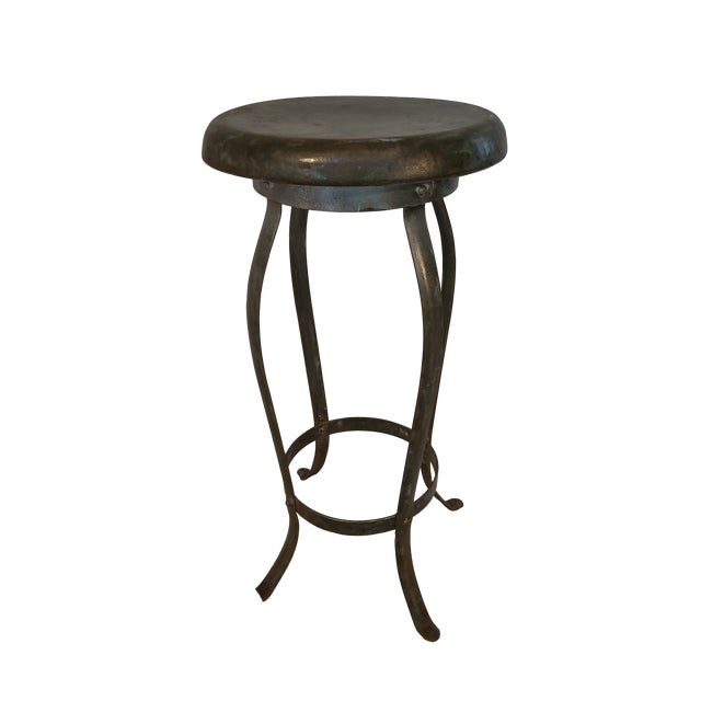 This is a great vintage steel stool with a slightly oxidized patina.
