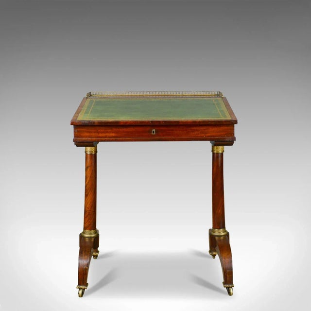 This is an antique writing table, an English, Regency, mahogany, open Davenport dating to the early 19th century, circa...