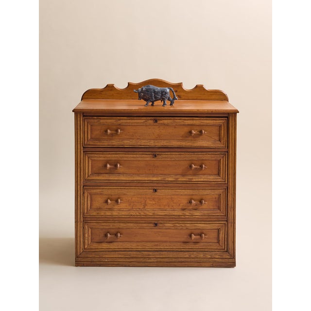 A warm and character-rich vintage oak dresser featuring four spacious drawers and a beautifully shaped gallery back. The...