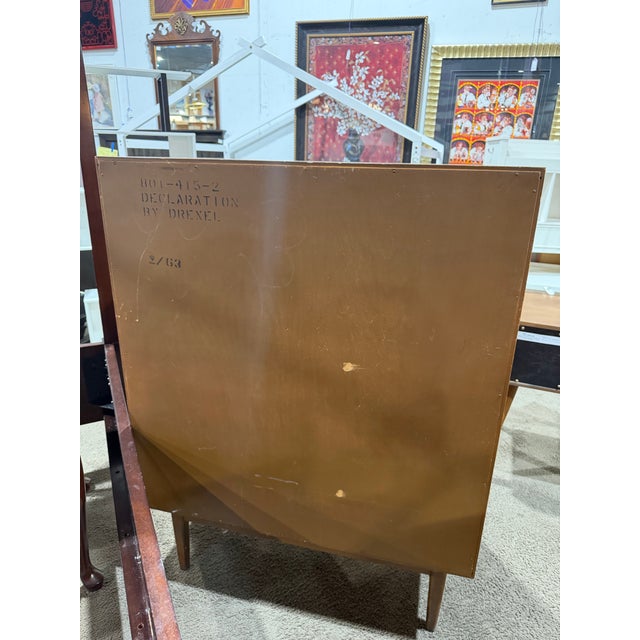 Elevate your space with the timeless craftsmanship of a Drexel Heritage Six-Drawer Chest of Drawers—a refined expression...