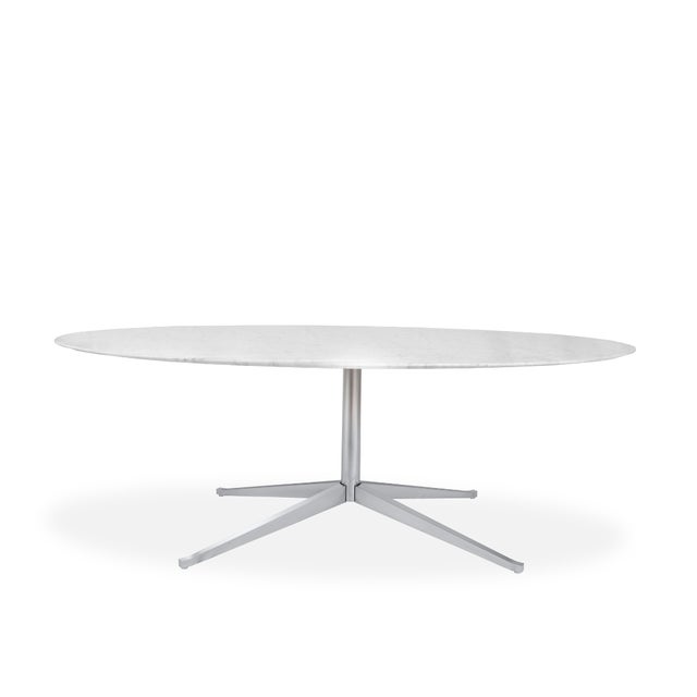 Crafted in 1961 by Florence Knoll, this iconic oval dining table features a luxe Carrara marble top supported by a sleek...