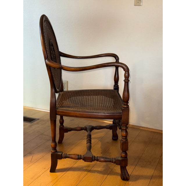 This beautiful walnut and cane Adams-style medallion back armchair with Flemish revival features was purchased new in...