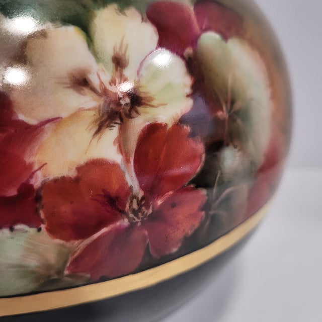This beautiful scalloped-edge glossy bowl vase has beautiful floral design on the upper half and black on the lower, with...