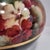 This beautiful scalloped-edge glossy bowl vase has beautiful floral design on the upper half and black on the lower, with...
