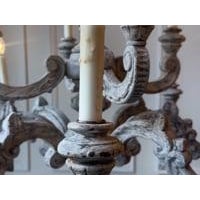 This impressive French 20th-century chandelier is a finely carved work in wood, distinguished by its grand scale and...