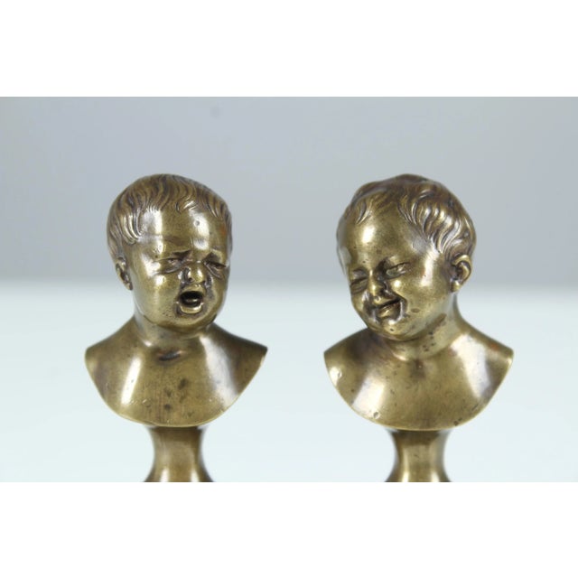 Antique pair of miniature busts of two children, one is crying and one is laughing. Beautiful bronze work, nicely chiseled...