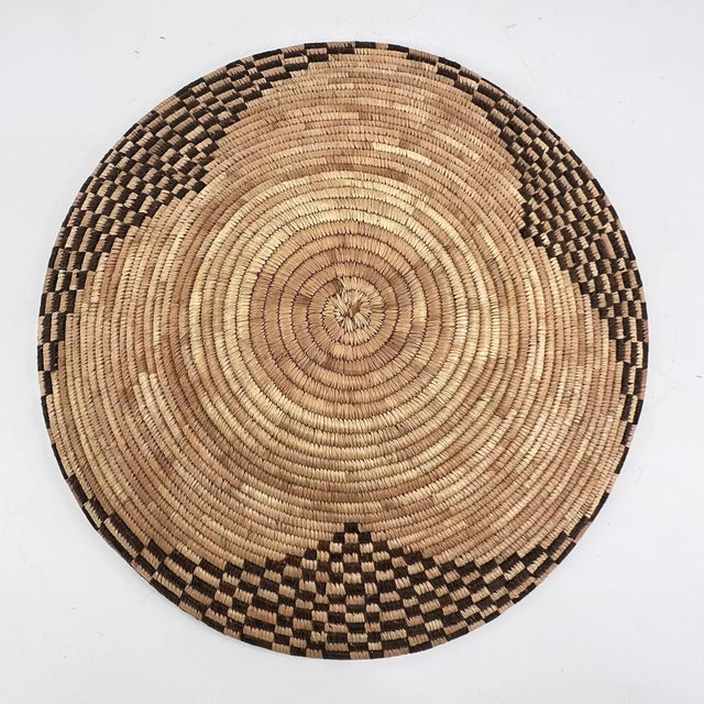 This handwoven basket from Botswana reflects a long-standing tradition of fiber artistry shared across southern Africa,...