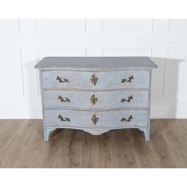 An elegant Swedish Rococo period chest of drawers, dating to circa 1760–1770, with a gracefully serpentine front and...