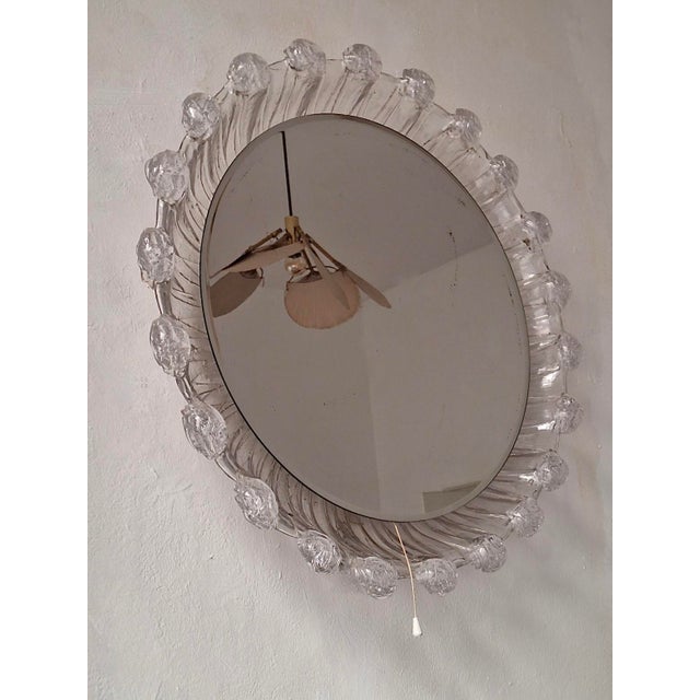 Large mid century melted ice effect illuminated circular wall mirror / wall light dating from about 1970. Beveled mirror.