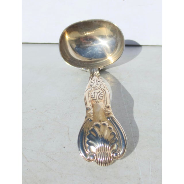 Sterling silver ladle, marked GJ and DF for George Jackson and David Fullerton, London 1903. The weight is 3 ounces and...