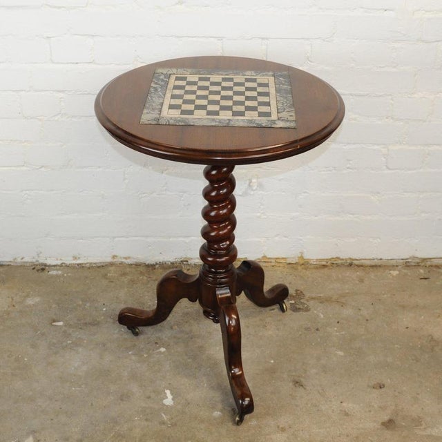 A decorative 19th century English chessboard Inlaid occasional tripod wine table on a turned pedestal. This piece is...