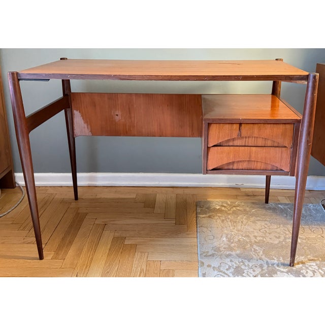 Beautiful two-layer Italian writing desk. This piece features abstract lines with full functionality. It brings a...