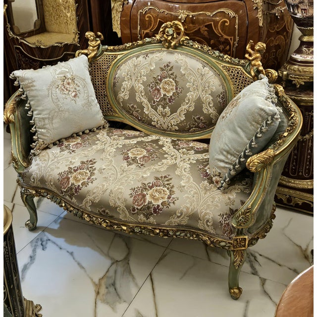 Bring regal European elegance to your home with this exquisite French-inspired loveseat, featuring sophisticated gray-...