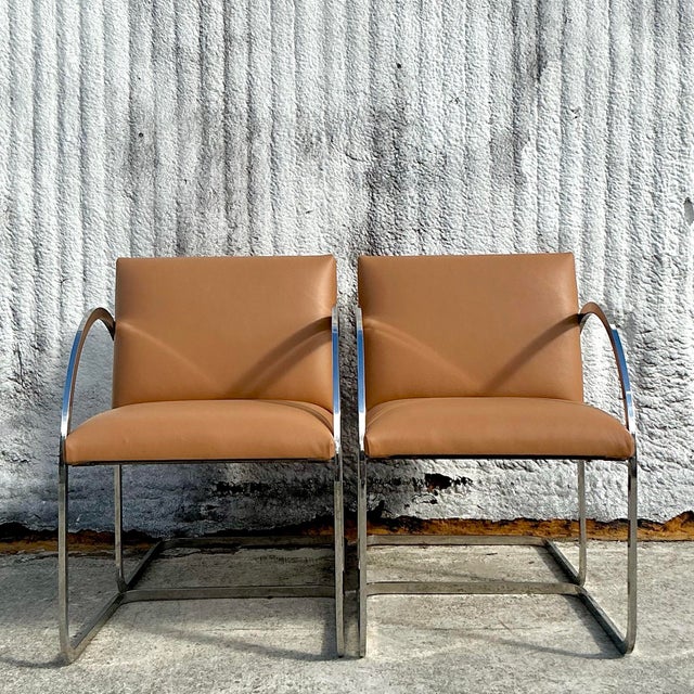 Make a bold design statement with these vintage Boho After Brueton flat bar dining chairs. Featuring sleek stainless steel...