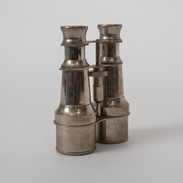 A refined pair of antique opera glasses, dating to circa 1900, likely of French or German origin. Crafted in nickel-plated...
