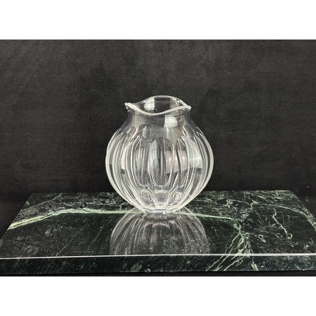 Clear crystal vase with a scalloped, ruffled rim and an all-over spiral swirl-cut pattern. No chips or cracks.