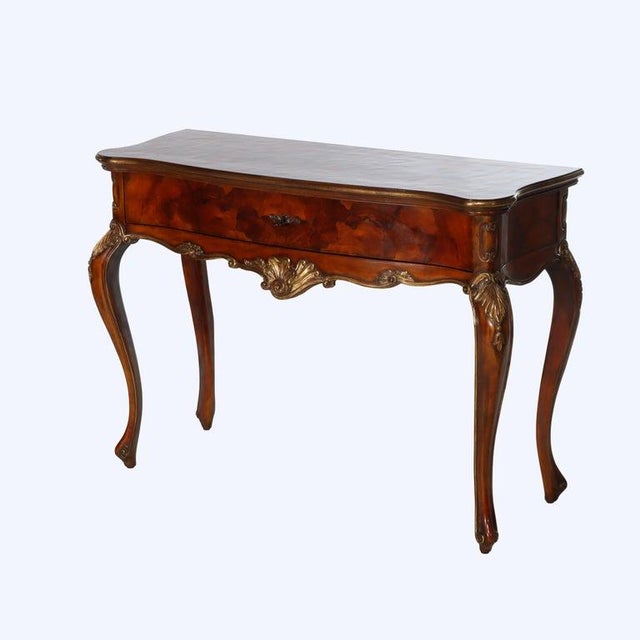 An exquisite Italian Louis XV style server, crafted in the 20th century, showcases the elegance of olivewood and mahogany...