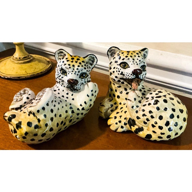 This is a set of Hollywood Regency Era playful Italian terracotta leopard cubs. They are both in very good condition.