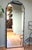 Add understated elegance to any space with this contemporary full-length floor mirror. Its slim steel frame and clean,...