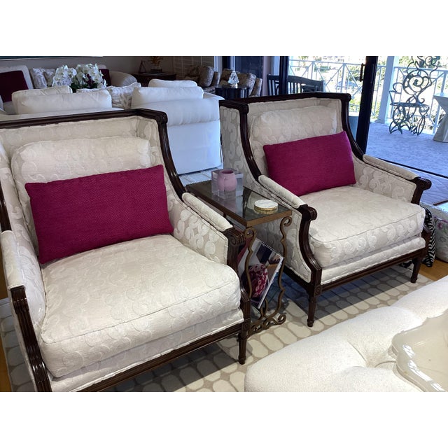 These pillows feature a rich woven texture of 63% acrylic and 37% polyester in a vibrant fuchsia hue. The yarns give the...