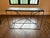 Michael Dawkins Mikado Console Table - Black Matte Wood Top with Black Metal Base Architectural elegance meets functional...
