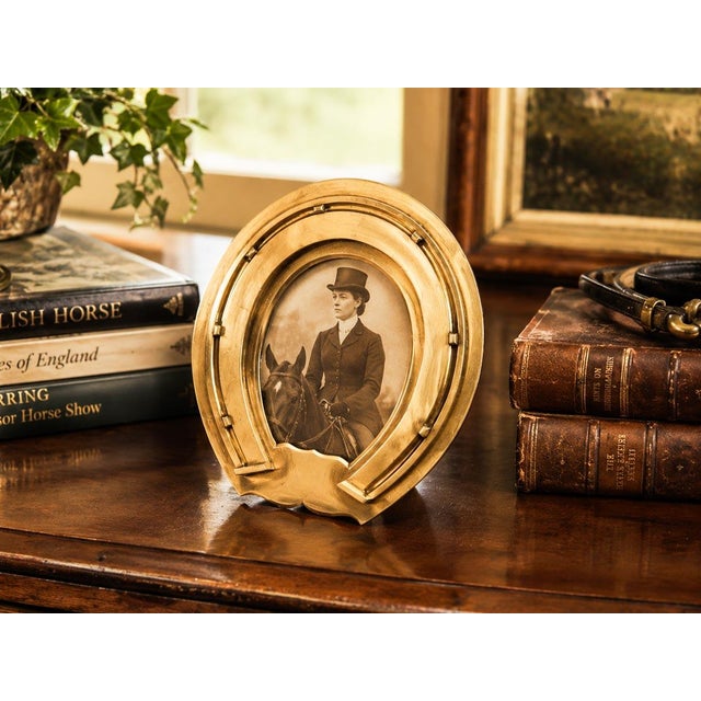 Step into the refined world of late Victorian luxury with this exceptionally rare antique horseshoe-form picture frame by...